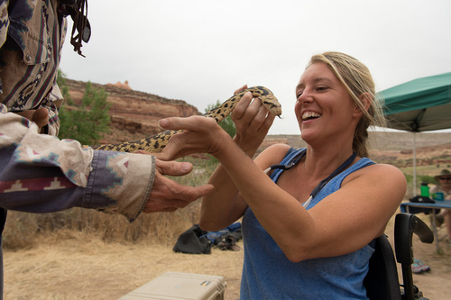 Francisco Kjolseth  |  The Salt Lake Tribune
Florida resident Gabrielle Ford, who is no stranger to the great outdoors, gets an up close a personal look at a gopher snake during a recent trip down the Colorado River with SPLORE, which provides outdoor opportunities to people of all ability levels.