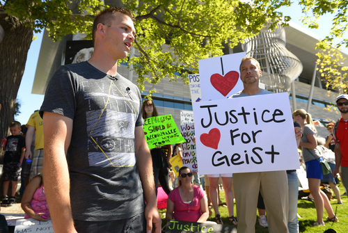 Leah Hogsten  |  The Salt Lake Tribune
Hundreds of supporters of Sean Kendall (left) and his dog, Geist, who was shot and killed in his backyard by a Salt Lake City police officer during a search for a missing child, rally to protest the officer's action, Saturday, June 28, 2014 at the SLC Police headquarters.