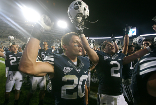Rick Egan  | The Salt Lake Tribune 

Brigham Young Cougars defensive back Craig Bills (20) and Brigham Young Cougars linebacker Spencer Hadley celebrate their 40-21 win over the University of Texas at Lavell Edwards stadium, Saturday, September 7, 2013.
