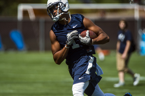 Chris Detrick  |  The Salt Lake Tribune
Brigham Young Cougars wide receiver Ross Apo (1) makes a catch during a practice at Richards Building Fields Friday August 1, 2014.
