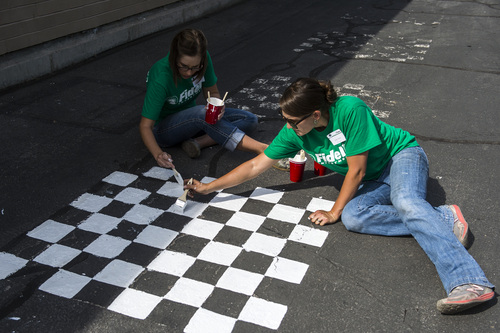 Chris Detrick  |  The Salt Lake Tribune
Emily Helm, of Taylorsville, and Lynae Leonard, of Herriman, help to repaint a checkerboard at Jackson Elementary School in Salt Lake City Saturday August 2, 2014. Over two hundred Fidelity Investments volunteers worked alongside students and teachers as part of the company's "School Transformation Day" program. Among other things, volunteers will be building a reading corner in the library, painting college-themed murals, building new garden beds and building two new First LEGO League tables for the school's robotics program.