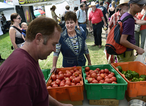 Scott Sommerdorf   |  The Salt Lake Tribune
Kicking off National Farmers Market Week, Utah's Commissioner of Agriculture, LuAnn Adams visited the Grammy's Fruit and Produce booth as she joined vendors to discuss the importance of farmers markets in Utah at the Wasatch Front Farmers Market at Wheeler Historic Farm, Sunday, August 3, 2014.