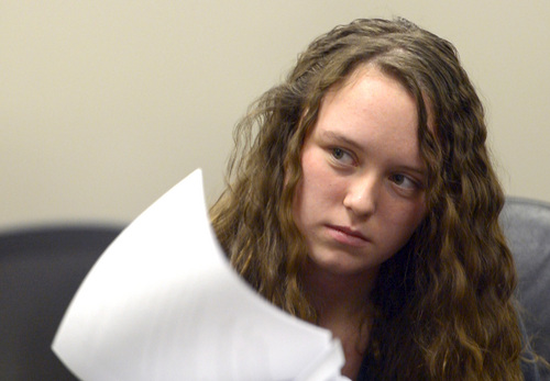 Rick Egan  |  Tribune file photo

Meagan Grunwald, a teen charged in connection with a fatal officer shooting in Utah County, listens to defense attorney Rhome Zabriskie during a recess in her preliminary hearing in Judge Darold McDade's courtroom in Provo Thursday April 17, 2014