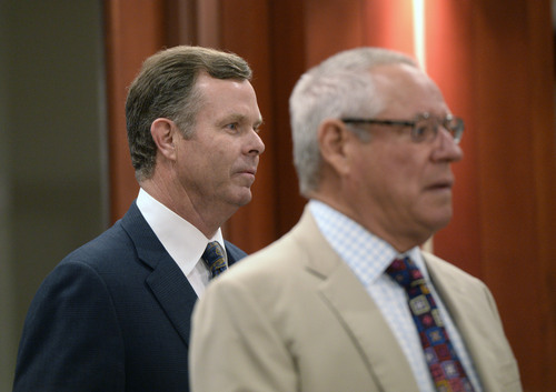 Al Hartmann  |  The Salt Lake Tribune 
Former attorney general John Swallow, left, and his attorney Stephen McCaughey enter Judge Royal Hansen's courtroom in Salt Lake City Wednesday July 30.  Swallow along with former attorney general Mark Shurtleff are charged with receiving or soliciting bribes, accepting gifts, tampering with evidence, obstructing justice and participating in a pattern of unlawful conduct.