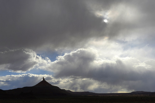 Al Hartmann  |  The Salt Lake Tribune 
North Six-Shooter Peak is cast in shadow as a Spring rain sweeps over the Canyon Rims area just south of U-111.  It is an area up for consideration for inclusion into an expanded Canyonlands National Park.