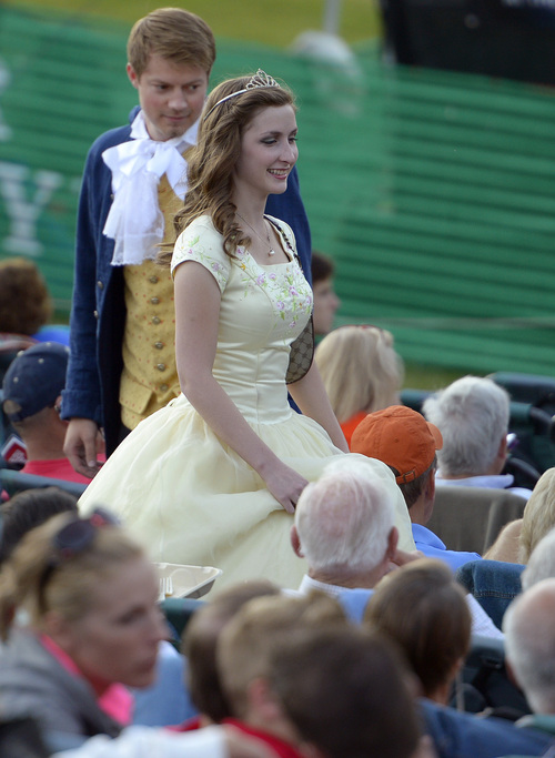 Leah Hogsten  |  The Salt Lake Tribune
A couple dressed as Disney characters takes their seats as  the Utah Symphony performs classics from the Disney songbook during a Deer Valley Music Festival's  "Disney in Concert: Tale as Old as Time" performance,  August 1, 2014. The evening featured the orchestra and four singers -- Anthony Apicella, Terron Brooks, Juliana Hansen and Arielle Jacobs -- as they perform numbers from the Disney songbook, ranging from songs from the smash hit "Frozen" to a 1935 animated short of Mickey Mouse in "The Band Concert," set to Rossini's "William Tell" Overture.