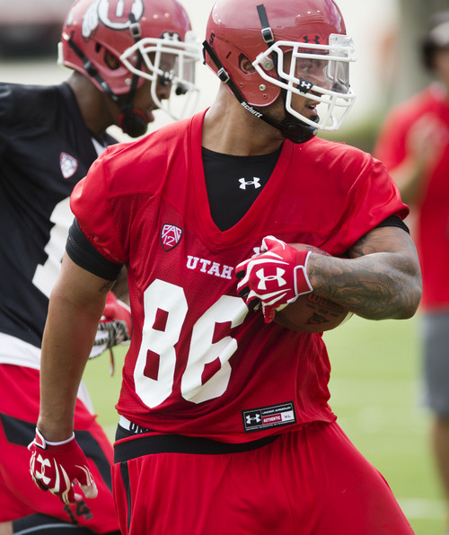Steve Griffin  |  The Salt Lake Tribune


Utah tight end Wallace Gonzalez tucks the football in after grabbing a pass from Travis Wilson during football practice at Rice Eccles Stadium in Salt Lake City, Utah Monday, August 4, 2014.