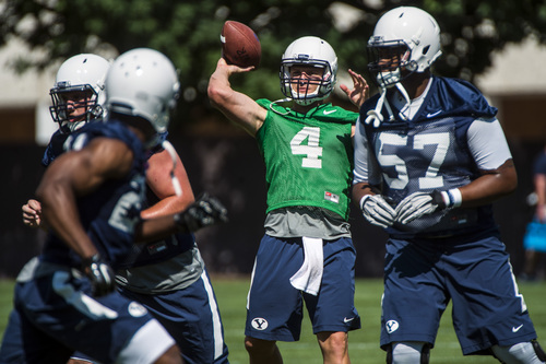 Chris Detrick  |  The Salt Lake Tribune
Brigham Young Cougars quarterback Taysom Hill (4) during a practice at Richards Building Fields Friday August 1, 2014.