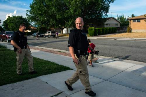 Chris Detrick  |  The Salt Lake Tribune
Adult Probation and Parole agent Chris Moore, left, and Assistant Regional Administrator Nathan Griffiths walk back to their car after talking with probationer Elisa Kelly, 29, during an unscheduled visit at her home in West Valley City Thursday July 31, 2014.