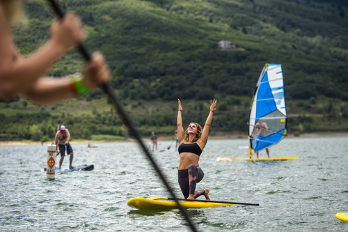 Chris Detrick  |  The Salt Lake Tribune
Stoked Yogi founder and CEO Amelia Travis, of San Diego, does yoga on a Glide Paddleboard during the Open Air Demo at Pineview Reservoir Tuesday August 5, 2014.  The Open Air Demo experience puts the industry's pioneering gear into the hands of key retail decision makers and media, giving them first-hand experience and insight into the latest apparel, camping, fly fishing, GPS/geocaching, hiking, hydration, paddle sports, SUP, travel and trail running-focused products. Outdoor Retailer (OR) brings together retailers, manufacturers, industry advocates and media to conduct the business of outdoor recreation through trade shows, product demo events and web-based business solutions.