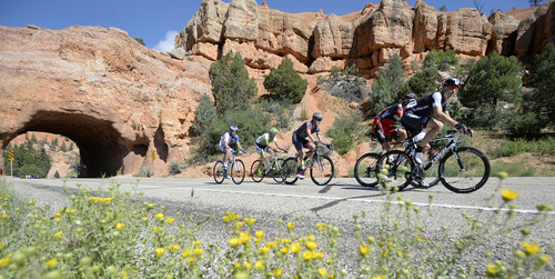 Al Hartmann  |  The Salt Lake Tribune 
Five breakaway riders emerge from the tunnels in Red Canyon during the Tour of Utah second stage Tuesday August 5, 2014. The second stage of the race ran along scenic SR 12 from Panguitch to Torrey covering 130 miles. The race takes a northerly serpentine path through Red Canyon, Bryce Canyon National Park, Grand Staircase-Escalante National Monument and the Dixie National Forest. Racers ecountered 10,162 feet of climbing on this longest stage of the week, passing the towns of Tropic, Escalante and Boulder and downhill into Torrey.