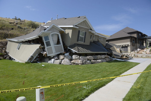 Al Hartmann  |  The Salt Lake Tribune 
A  home destroyed by a landslide at Parkway Drive in North Salt Lake. Residents returned to their  homes Wednesday, a day after a landslide destroyed the home and others had to be evacuated.