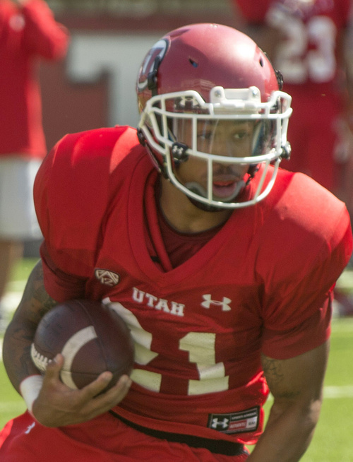 Rick Egan  |  The Salt Lake Tribune

Ute QB, Kendal Thompson looks to pass Troy McCormick runs with the ball during practice at Rice Eccles Stadium, Wednesday, August 6, 2014