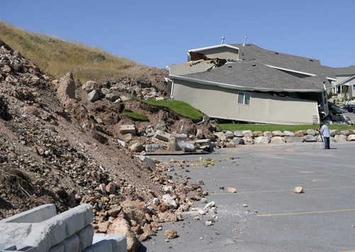 Al Hartmann  |  The Salt Lake Tribune 
A home destroyed by landslide at Parkway Drive in North Salt Lake. Rubble from the landslide fell into the parking lot of Eagleridge Tennis and Swim Club next door. Residents returned to their homes Wednesday, a day after a landslide destroyed the home and others had to be evacuated.
