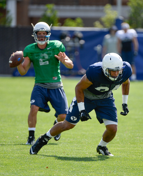 Francisco Kjolseth  |  The Salt Lake Tribune
BYU's tight end, Devin Mahina, No. 84, works out with the rest of the team during the first practice of the season.