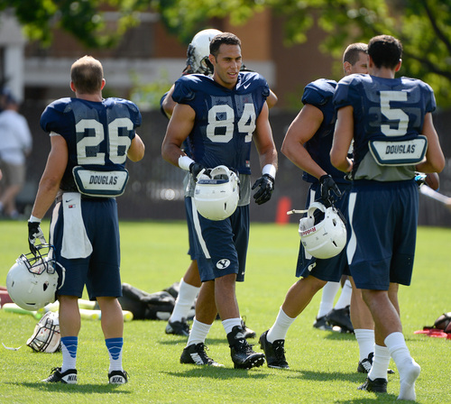 Francisco Kjolseth  |  The Salt Lake Tribune
BYU's tight end, Devin Mahina, No. 84, works out with the rest of the team during the first practice of the season.