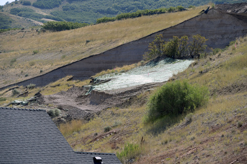 Al Hartmann  |  The Salt Lake Tribune 
The scene of Tuesday's landslide.  Residents returned to their homes along Parkway Drive in North Salt Lake Wednesday Aug. 6, 2014, a day after a landslide destroyed a home and others had to be evacuated.