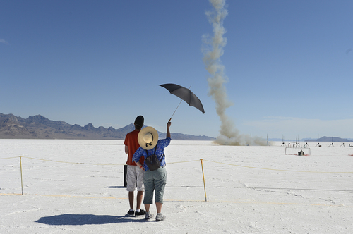Scott Sommerdorf   |  The Salt Lake Tribune
Participants watch a rocket launch on the Bonneville Salt Flats. The Utah Rocket Club's "Hellfire" event draws rocket hobbyists from throughout the United States. It is free to the public, each year attracting a sizable crowd of spectators, Saturday, Aug. 2, 2014.