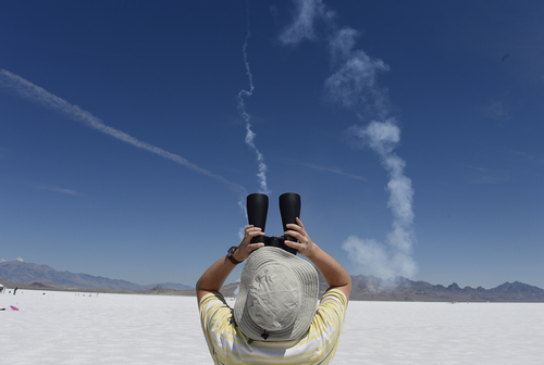Scott Sommerdorf   |  The Salt Lake Tribune
A spectator watches the flight of a rocket launch. The Utah Rocket Club's "Hellfire" event draws rocket hobbyists from throughout the United States. It is free to the public, each year attracting a sizable crowd of spectators, Saturday, Aug. 2, 2014.