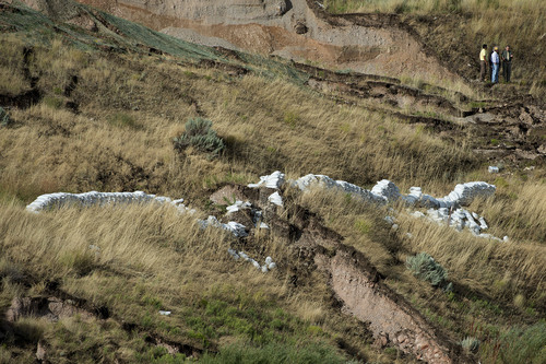 Jeremy Harmon  |  The Salt Lake Tribune

Sandbags are seen on the hillside above 739 Parkway Drive in North Salt Lake where a home was destroyed by a landslide early in the morning on Tuesday, August 5, 2014.