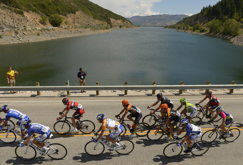 Cyclists pass over the Pineview Dam on one of their three laps around the Pineview Reservoir in Huntsville, Utah, during the fourth stage of the Tour of Utah on Thursday, Aug. 7, 2014.  (AP Photo/The Salt Lake Tribune, Leah Hogsten)  DESERET NEWS OUT; LOCAL TELEVISION OUT; MAGS OUT