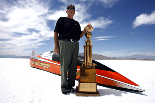 Rick Egan   |  The Salt Lake Tribune

George Poteet stands by his car "Speed Demon" along with the Hot Rod Magazine Trophy, at the Bonneville Salt Flats, Thursday, August 18, 2011. The Speed Demon's top speed was 427 mph.