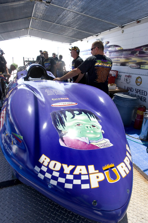 Paul Fraughton  |   Salt Lake Tribune
   Nish Motorsport's Royal Purple  is worked on in the team's pit area.                        
 Tuesday, August 13, 2013