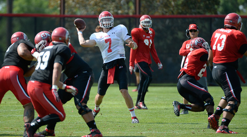 Francisco Kjolseth  |  The Salt Lake Tribune
Utes quarterback Travis Wilson looks for an opening as the football team goes into week one of practice with the first full contact practice with all pads.