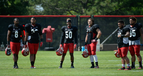 Francisco Kjolseth  |  The Salt Lake Tribune
Utah's defense keeps an eye on the action as the team  goes into week one of practice with all pads.