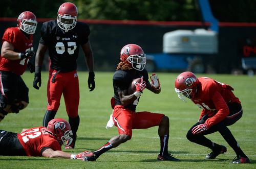 Francisco Kjolseth  |  The Salt Lake Tribune
Defensive back Travonne Hobbs runs in for a catch on a fumble as the Utes football goes into week one of practice with all pads.