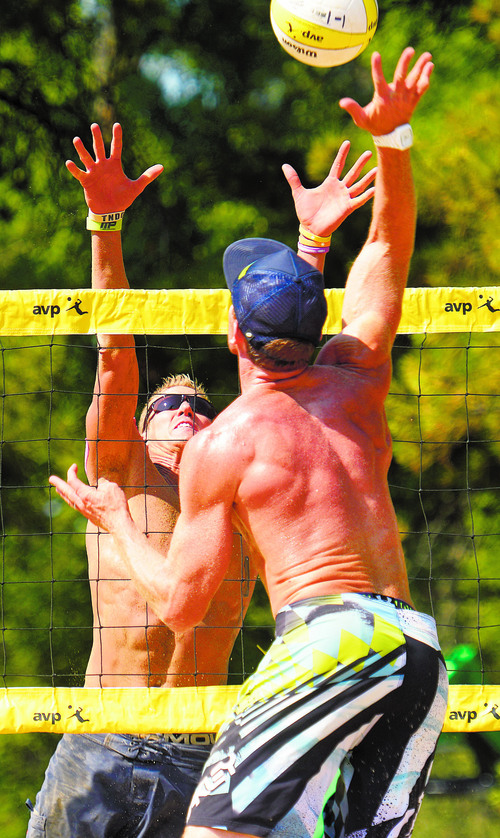 Rick Egan  |  The Salt Lake Tribune

Casey Jennings hits the ball, as Mark Burik defends, in AVP Pro Beach Volleyball tournament action, at Liberty Park, Friday, August 8, 2014