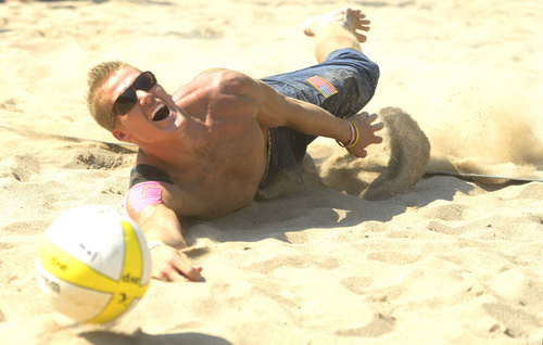 Rick Egan  |  The Salt Lake Tribune

Mark Burik dives for the ball, in AVP Pro Beach Volleyball tournament action, at Liberty Park, Friday, August 8, 2014