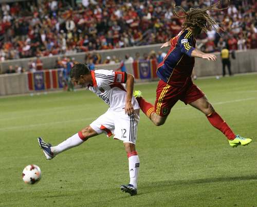 Leah Hogsten | The Salt Lake Tribune
Real Salt Lake midfielder Kyle Beckerman (5) fights   Silva (12).  Real Salt Lake lost the 2013 U.S. Open Cup Final to D.C. United 1-0 at Rio Tinto Stadium in Sandy, Utah, Tuesday, October 1, 2013. The winner will play in the CONCACAF Champions League.