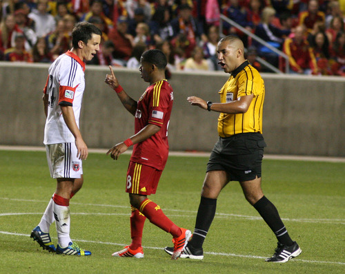 Leah Hogsten | The Salt Lake Tribune
Real Salt Lake forward Jou Plata (8) and D.C. United midfielder Lewis Neal (24) jaw each other before Neal received a yellow card. The 2013 Lamar Hunt U.S. Open Cup Final kicked off Tuesday when Real Salt Lake hosted D.C. United at Rio Tinto Stadium in Sandy, Utah, Tuesday, October 1, 2013. The winner will get a spot in the CONCACAF Champions League.