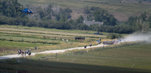 Steve Griffin  |  The Salt Lake Tribune


The Tour of Utah peloton, right, chases a small group of breakaway riders as riders battle a two-mile stretch of dirt road on their way to the finish line in Kamas, Utah Friday, August 8, 2014 during the fifth stage of the event.  Riders road between Evanston and Kamas  two gateway cities to the High Uintas Wilderness and beautiful Mirror Lake Scenic Byway.
