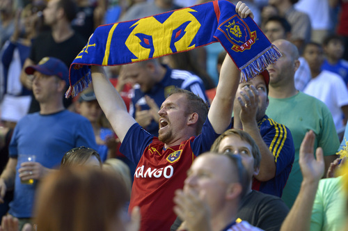 Fans sing as Real Salt Lake took a 3-0 lead over D.C. United in the first half of an MLS soccer game Saturday, Aug. 9, 2014, in Sandy, Utah. (AP Photo/The Salt Lake Tribune, Leah Hogsten)