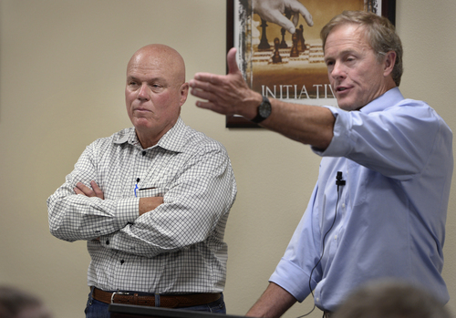 Scott Sommerdorf   |  The Salt Lake Tribune
UEP attorney Jeff Shields speaks at a meeting held at Mohave Community College in Colorado City to discuss the UEP distribution. UEP fiduciary Bruce Wisan is at left, Saturday, August 9, 2014.