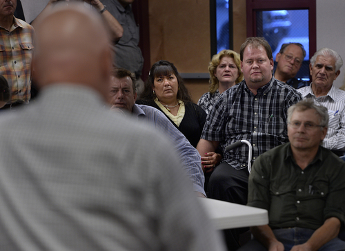 Scott Sommerdorf   |  The Salt Lake Tribune
Jinjer and Ron Cooke sit in the UEP community meeting as they listen to UEP fiduciary Bruce Wisan speak at El Capitan School, Saturday, August 9, 2014.