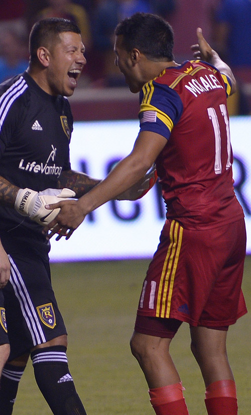 Leah Hogsten  |  The Salt Lake Tribune
Real Salt Lake goalkeeper Nick Rimando (18) celebrates his new MLS record for career game shutouts at 113 with Real Salt Lake midfielder Javier Morales (11). Real Salt Lake defeated D. C. United 3-0 Saturday, August 9, 2014, at Rio Tinto Stadium.