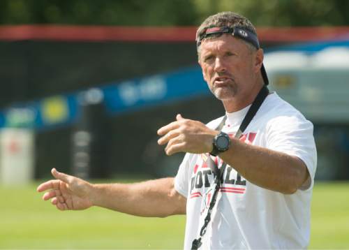 Rick Egan  |  The Salt Lake Tribune

Head coach Kyle Whittingham, gives directions to his team, at the University of Utah football practice, Saturday, August 9, 2014