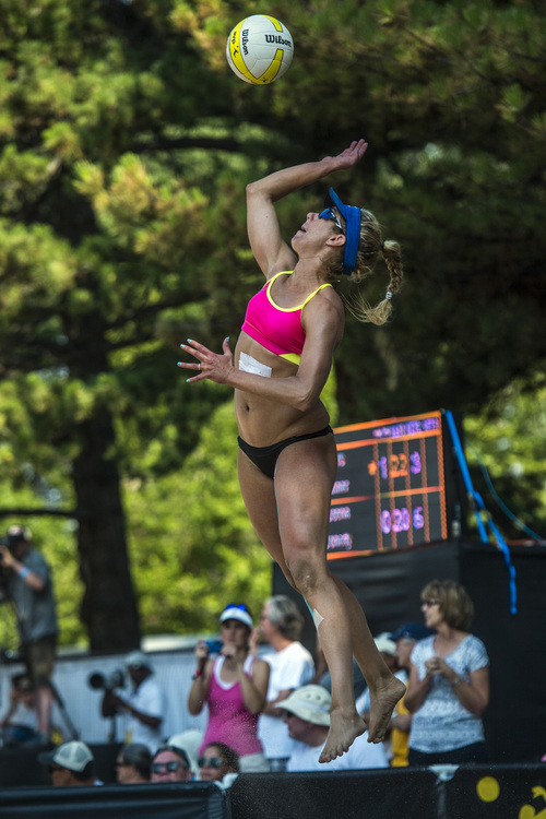 Chris Detrick  |  The Salt Lake Tribune
April Ross competes against Nicole Branagh and Amanda Dowdy during the AVP Pro Beach Volleyball tournament at Liberty Park Saturday August 9, 2014.