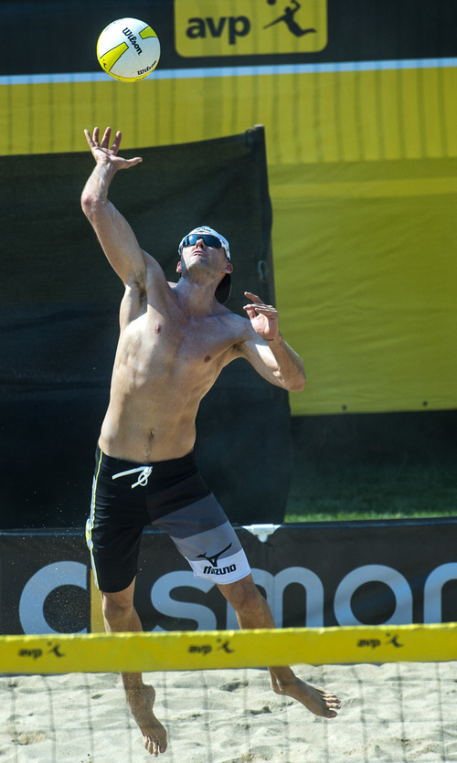 Chris Detrick  |  The Salt Lake Tribune
Jake Gibb serves against Jeremy Casebeer and Casey Jennings during the AVP Pro Beach Volleyball tournament at Liberty Park Saturday August 9, 2014.