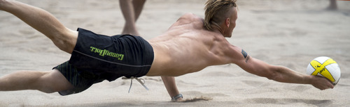 Steve Griffin  |  The Salt Lake Tribune


Casey Patterson dives and gets his hand under the ball as he digs it out during championship match in the AVP Professional Beach Volleyball Tournament at Liberty Park in Salt Lake City, Sunday, August 10, 2014.