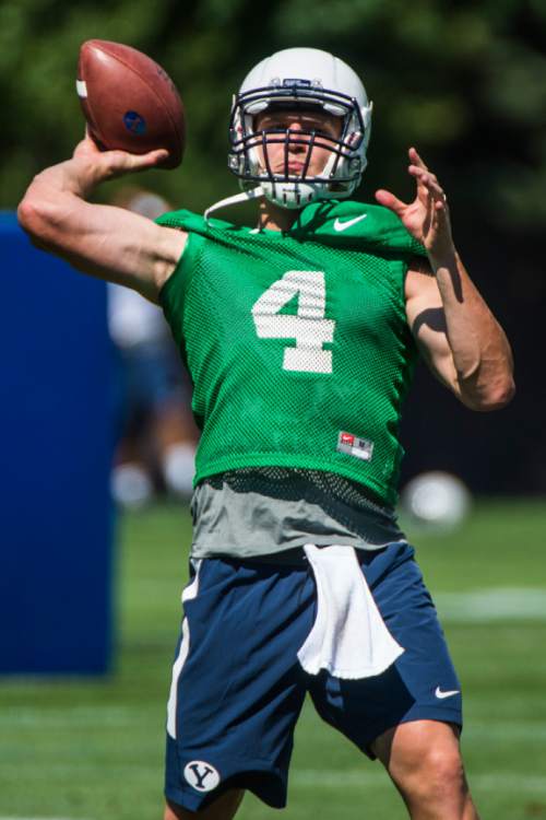Chris Detrick  |  The Salt Lake Tribune
Brigham Young Cougars quarterback Taysom Hill (4) during a practice at Richards Building Fields Friday August 1, 2014.