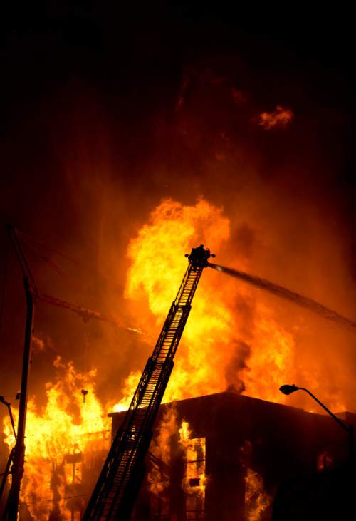 Lennie Mahler  |  The Salt Lake Tribune
Firefighters battle a four-alarm fire near downtown Salt Lake City, Sunday, Feb. 9, 2014.