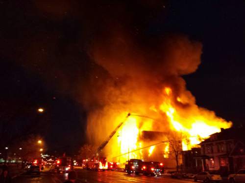 Lennie Mahler | The Salt Lake Tribune

A four-alarm fire burns in downtown Salt Lake City on the night of February 9, 2014.