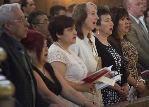 Rick Egan  |  The Salt Lake Tribune

Candidates sing during the Mass and Blessing of Lay Ecclesial Ministers at the Cathedral of the Madeleine, Saturday, August 9, 2014.  Eighty-five lay Catholics were commissioned Saturday by Bishop John Wester.