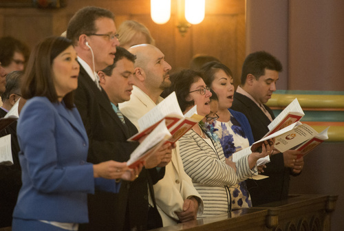 Rick Egan  |  The Salt Lake Tribune

Candidates sing during the Mass and Blessing of Lay Ecclesial Ministers at the Cathedral of the Madeleine, Saturday, August 9, 2014.  Eighty-five lay Catholics were commissioned Saturday by Bishop John Wester.