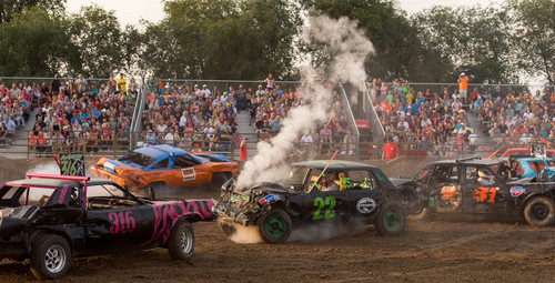 Trent Nelson  |  The Salt Lake Tribune
A car begins to smoke in the Dog Days Demolition derby at the Salt Lake County Fiar, Saturday August 9, 2014.