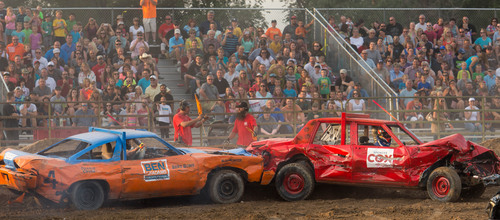 Trent Nelson  |  The Salt Lake Tribune
Salt Lake County Mayor Ben McAdams rams Lt. Gov. Spencer Cox, right, while competing in the Dog Days Demolition derby at the Salt Lake County Fair on Saturday.
